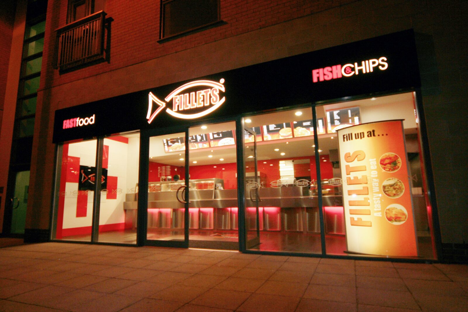 Fillets illuminated shopfront fascia at night